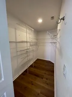 a bathroom with a double vanity sink toilet and mirror