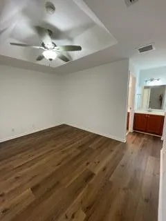 a spacious bathroom with a bathtub sink and mirror