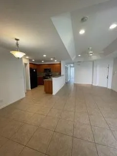 a kitchen with stainless steel appliances granite countertop a refrigerator stove and sink