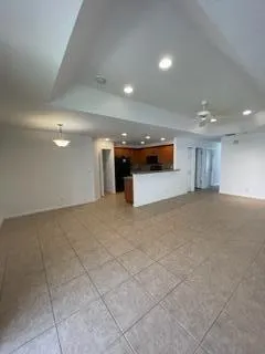 a kitchen with stainless steel appliances granite countertop a refrigerator and a stove