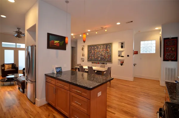a kitchen with granite countertop a sink and a stove top oven