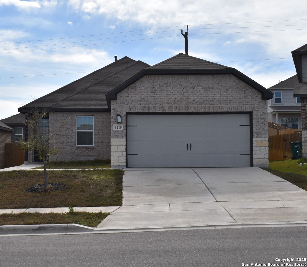 a front view of a house with garage