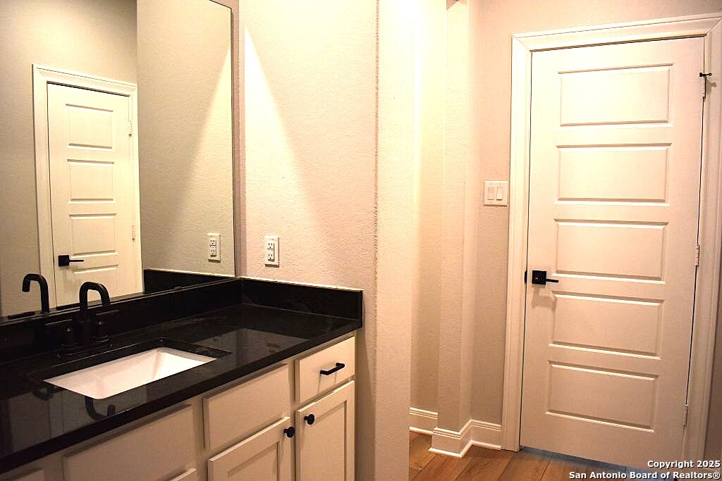 9210 Espadrille Run Converse, TX 78109 - Photo 7 of 17 a bathroom with a sink and a mirror