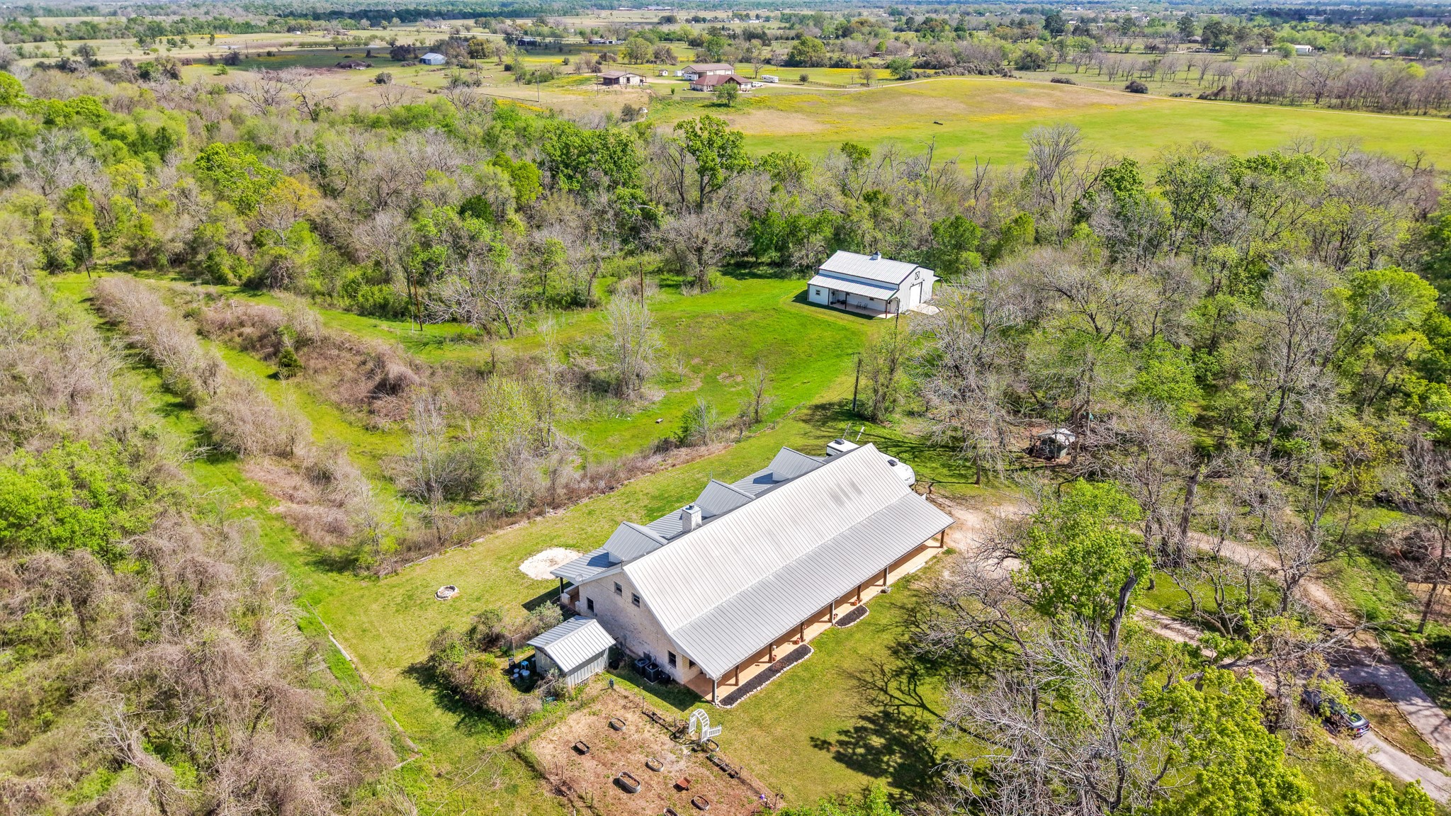 41712 Harpers Church Road Hempstead, TX 77445 - Photo 1 of 50 an aerial view of a residential houses with outdoor space and trees