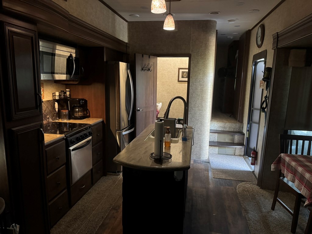 1640 Panther Top Road Murphy, NC 28906 - Photo 27 of 27 a kitchen with a refrigerator and a sink