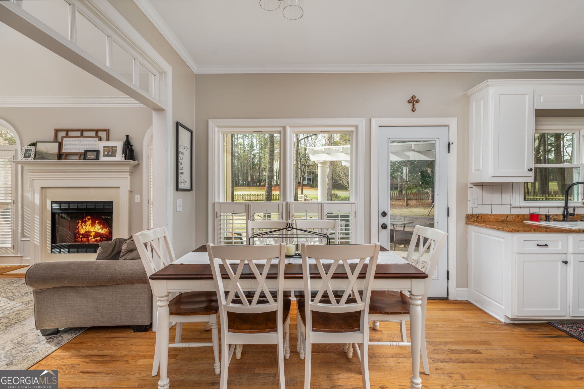 144 Cambridge Way Macon, GA 31220 - Photo 13 of 50 a dining room with furniture a fireplace and wooden floor