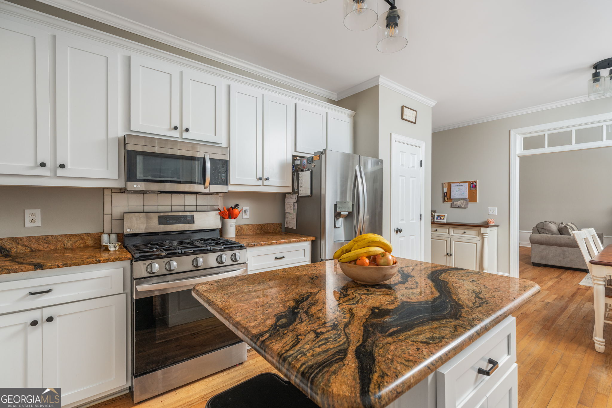 144 Cambridge Way Macon, GA 31220 - Photo 18 of 50 a kitchen with stainless steel appliances granite countertop a stove refrigerator and microwave
