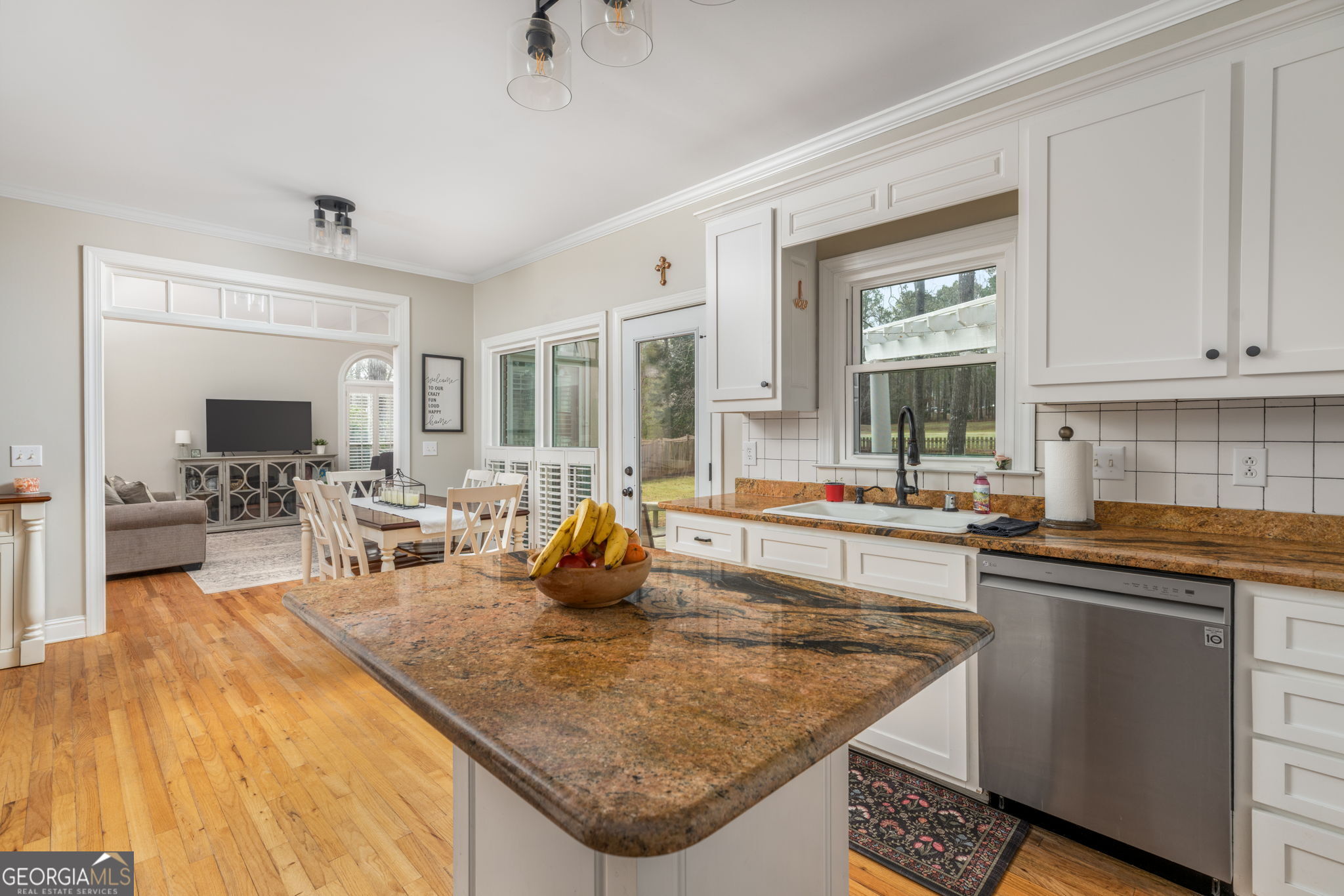 144 Cambridge Way Macon, GA 31220 - Photo 19 of 50 a kitchen with stainless steel appliances granite countertop a sink and cabinets