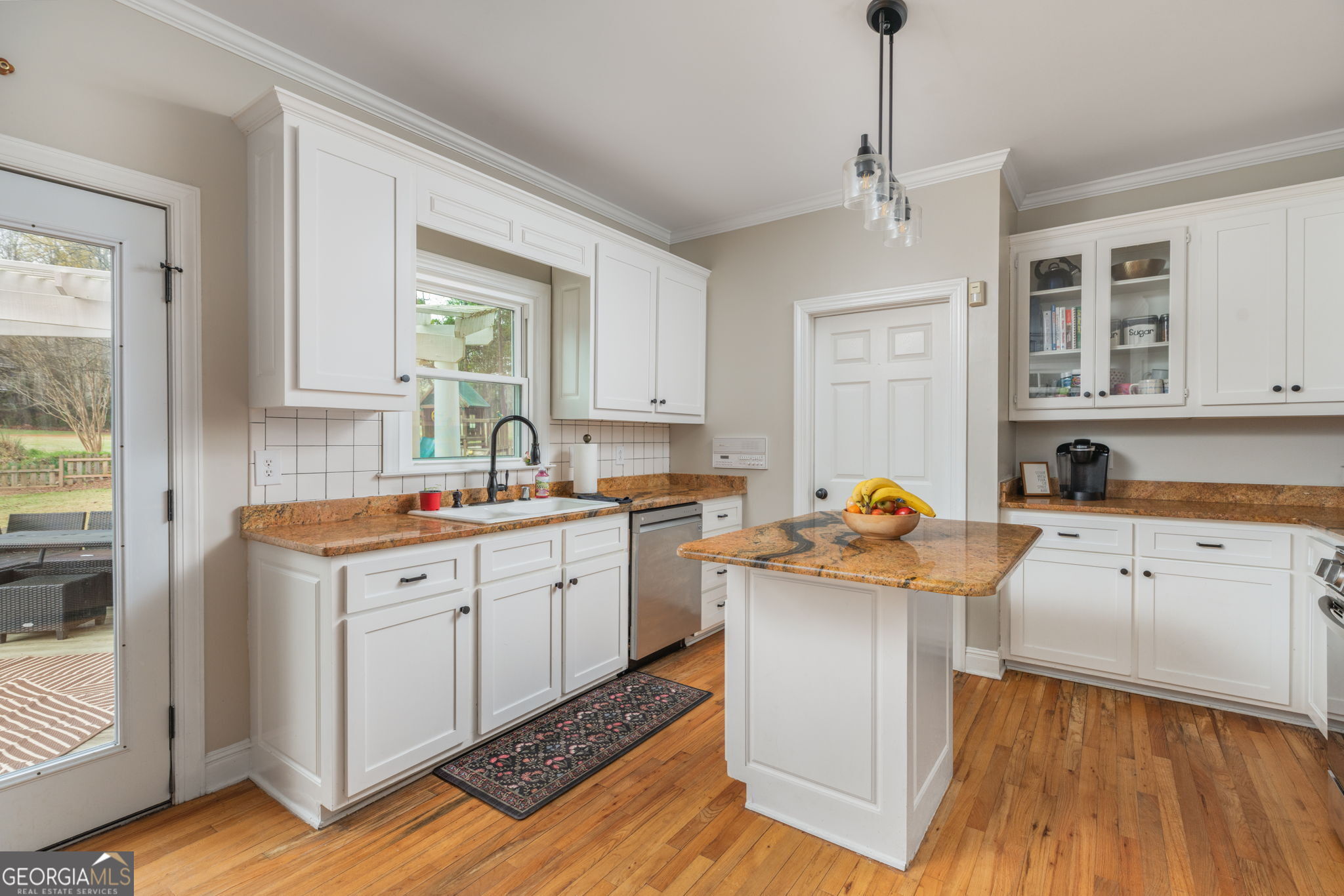 144 Cambridge Way Macon, GA 31220 - Photo 20 of 50 a kitchen that has a lot of cabinets in it and wooden floors