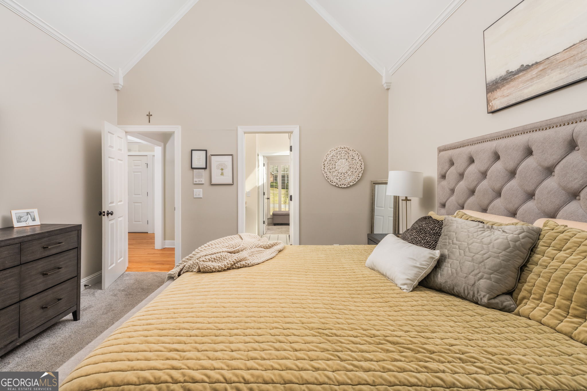 144 Cambridge Way Macon, GA 31220 - Photo 25 of 50 a large bed sitting in a bedroom and dresser