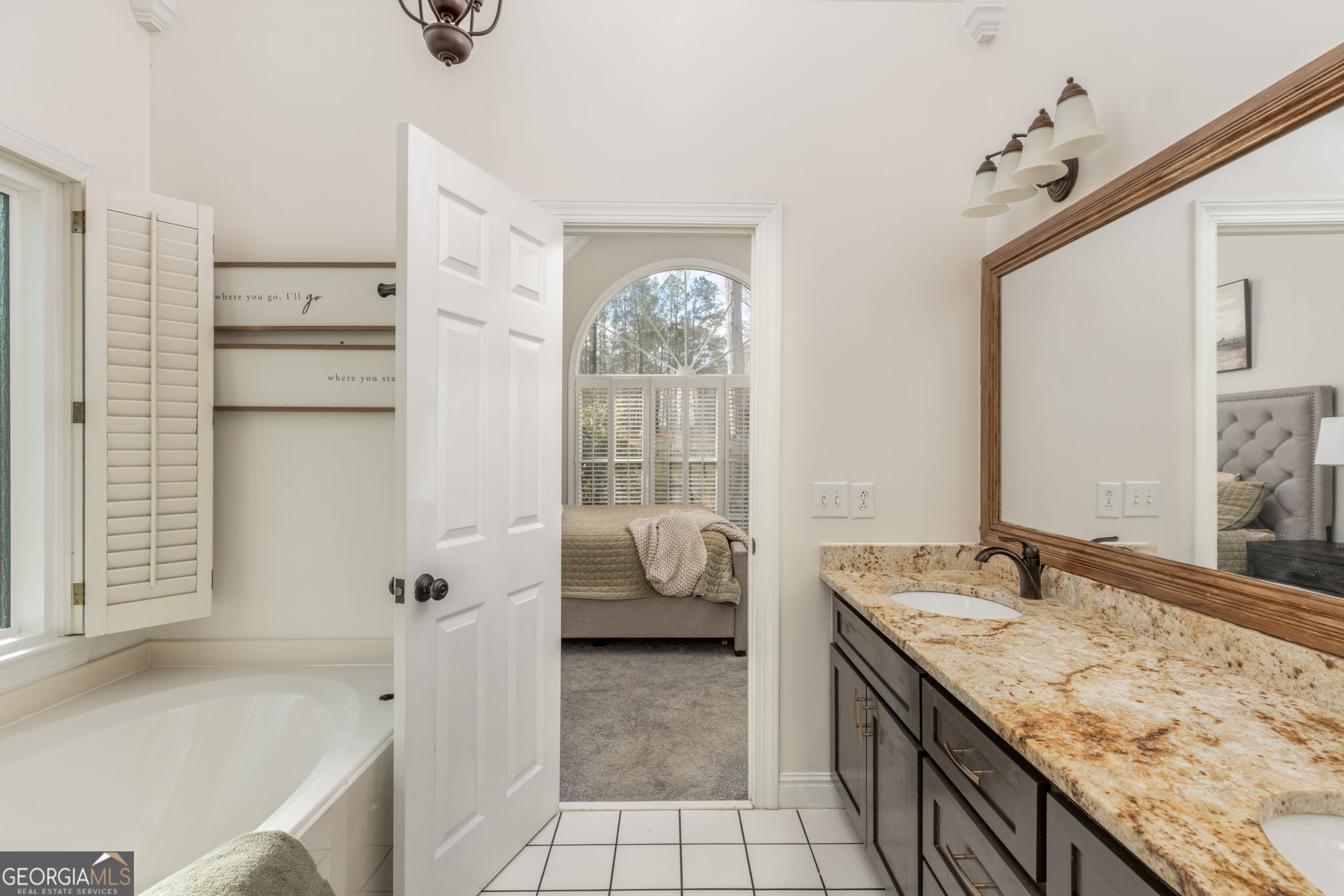 144 Cambridge Way Macon, GA 31220 - Photo 28 of 50 a spacious bathroom with a granite countertop tub sink and mirror