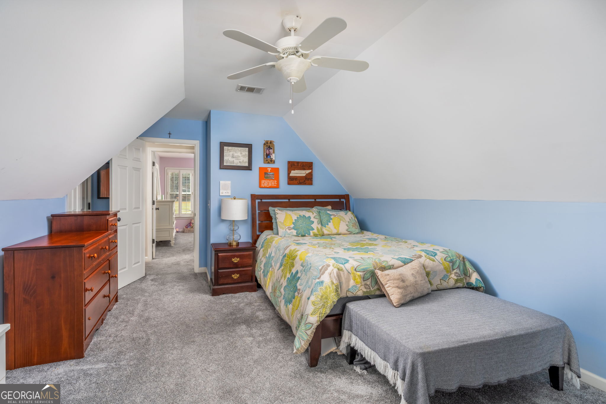 144 Cambridge Way Macon, GA 31220 - Photo 39 of 50 a bedroom with a bed and a chandelier