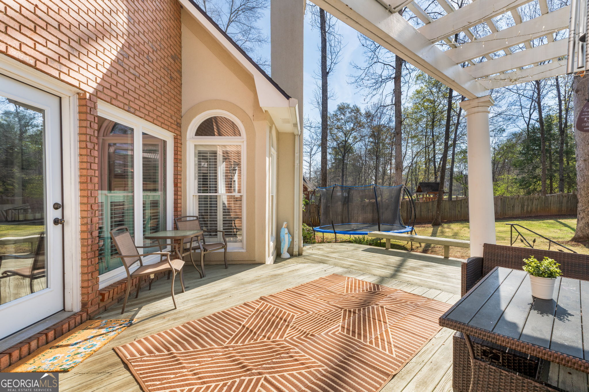 144 Cambridge Way Macon, GA 31220 - Photo 40 of 50 a view of a patio with a table and chairs