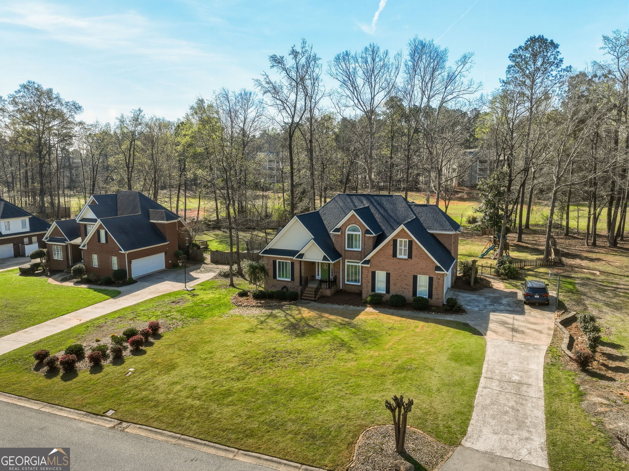 144 Cambridge Way Macon, GA 31220 - Photo 5 of 50 a view of a swimming pool with lawn chairs and a yard
