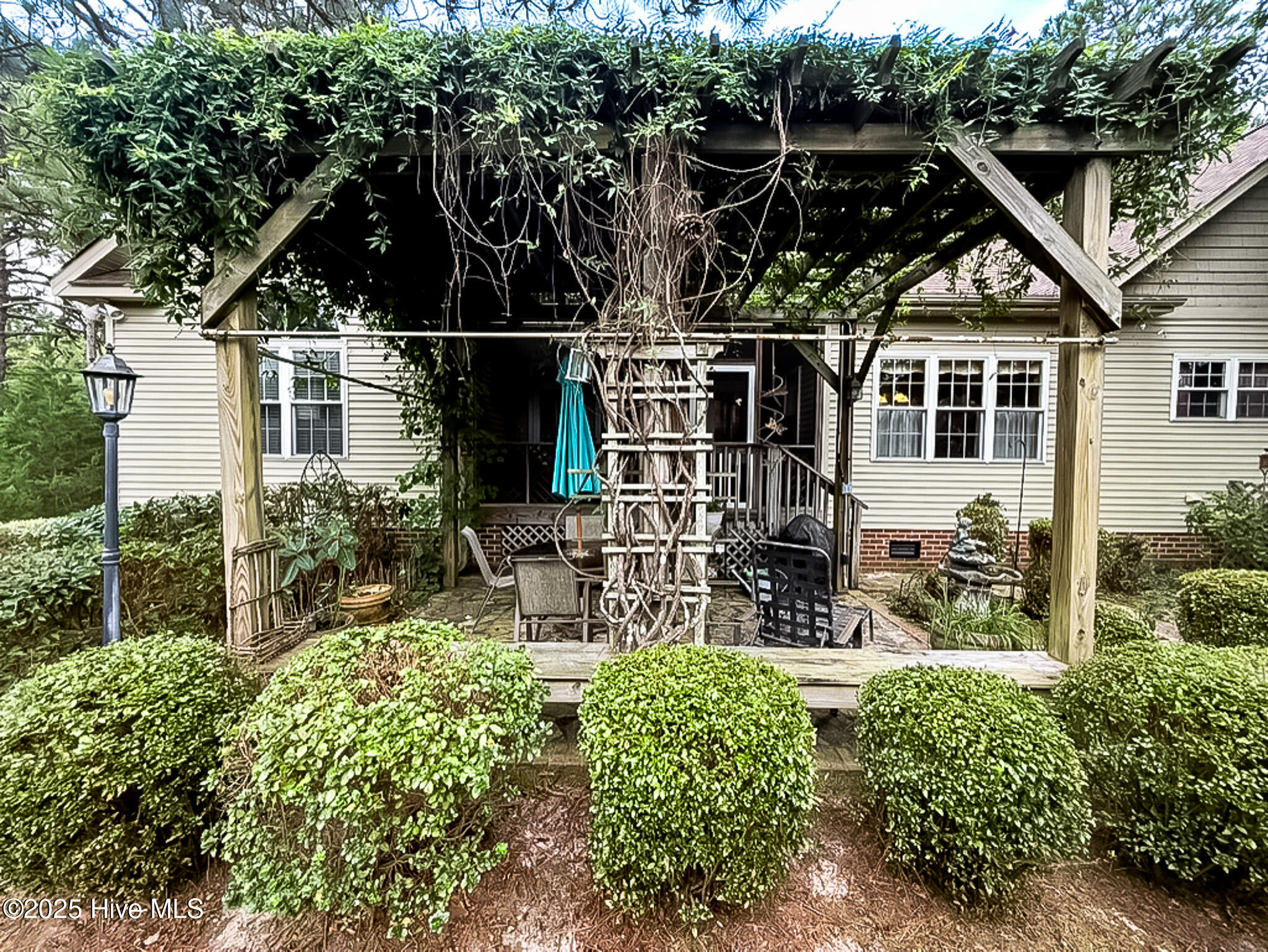 2 Troy Court Pinehurst, NC 28374 - Photo 12 of 71 Fenced in Section of the yard with Pergola that connects to the Screened Porch