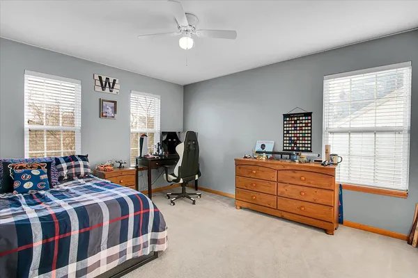 a bedroom with a bed and window