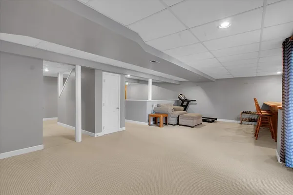 a view of a livingroom with furniture and a ceiling fan