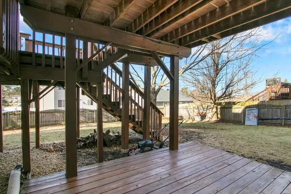 a view of outdoor space with wooden floor