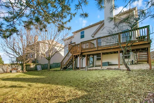 a house that has a tree in front of it