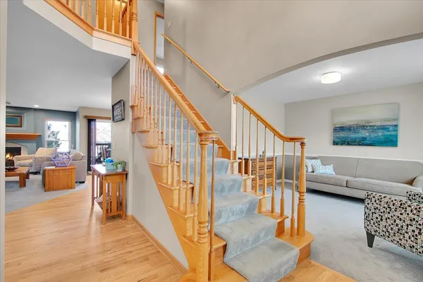 a view of entryway and hall with wooden floor