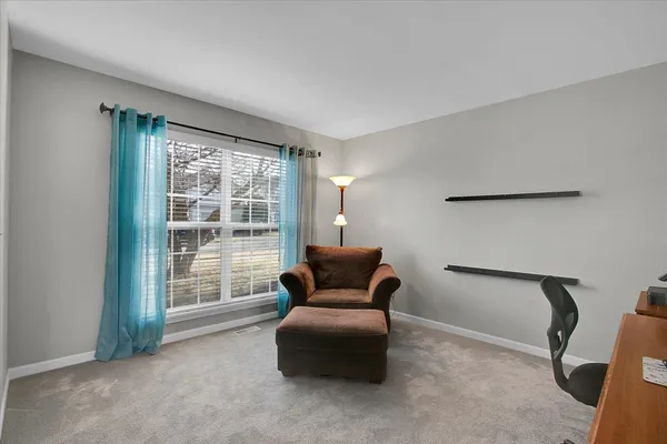 a bedroom with furniture and a window