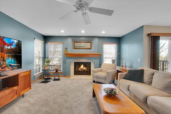 a living room with furniture and a fireplace