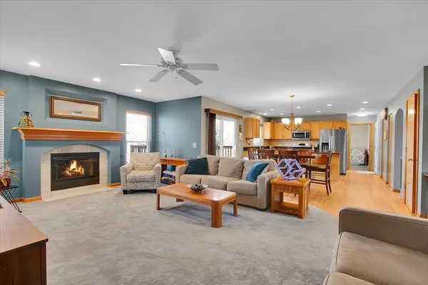 a living room with furniture and a fireplace