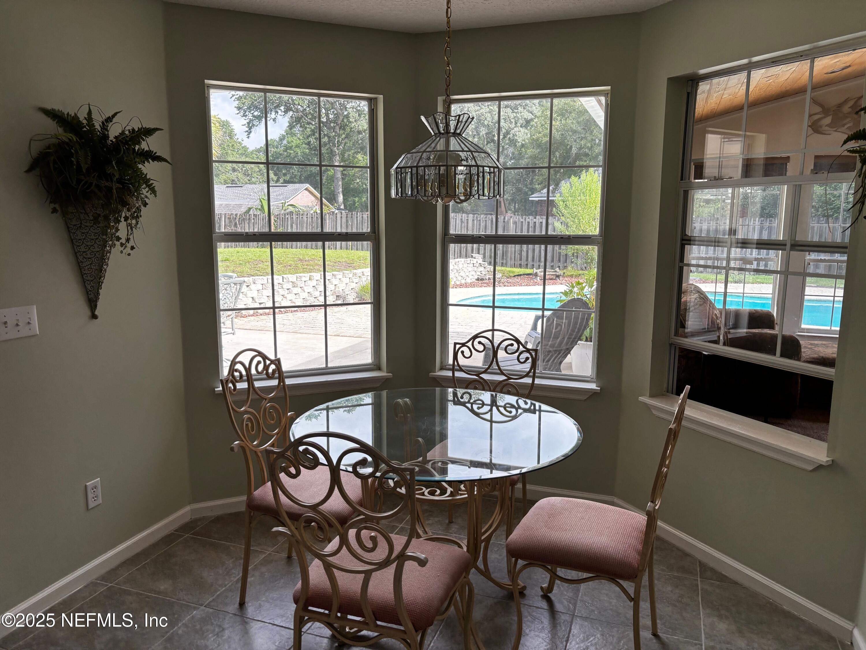 6121 Michele Road Macclenny, FL 32063 - Photo 11 of 26 a table and chairs in a room
