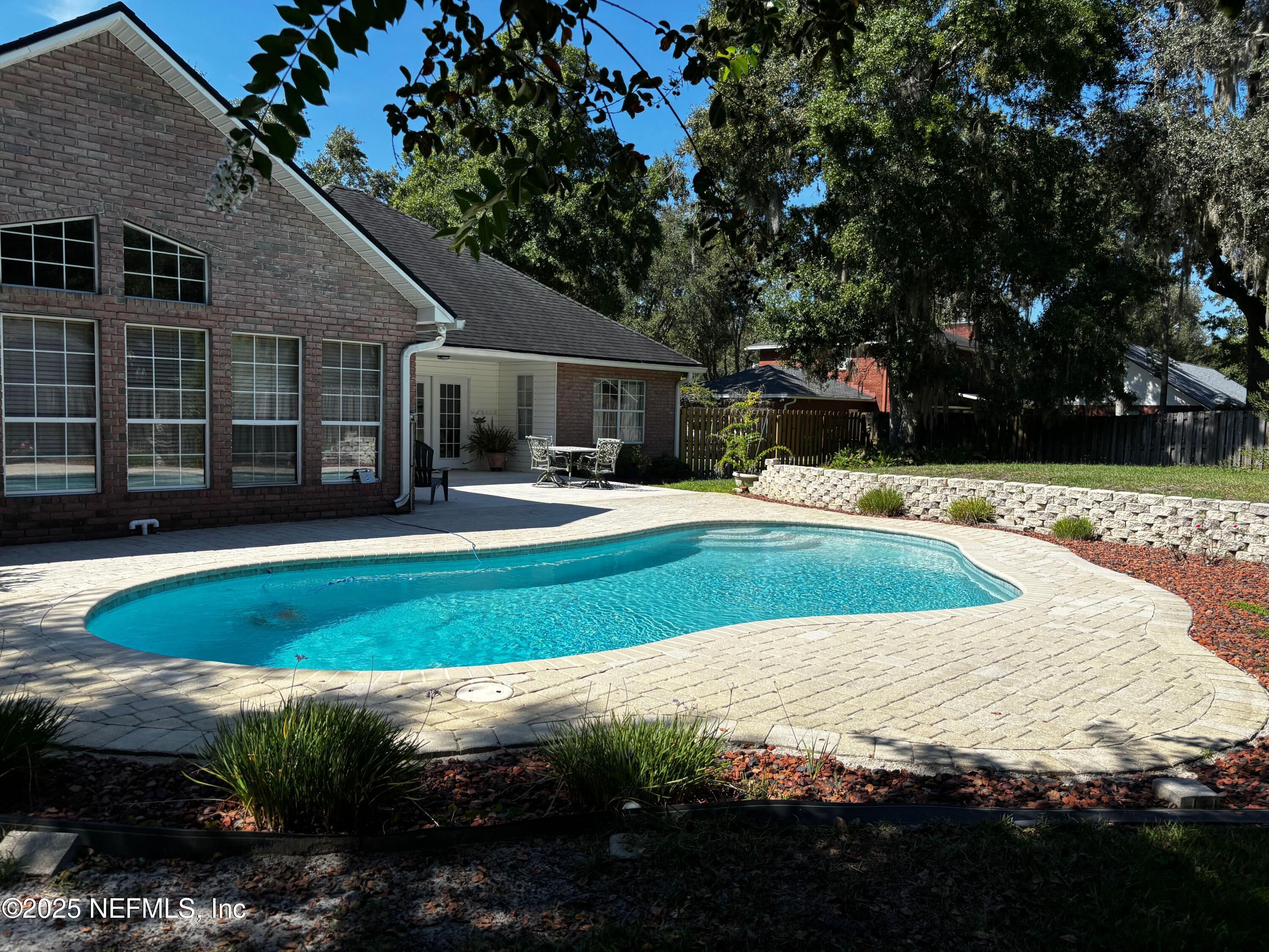 6121 Michele Road Macclenny, FL 32063 - Photo 12 of 26 a view of a house with backyard