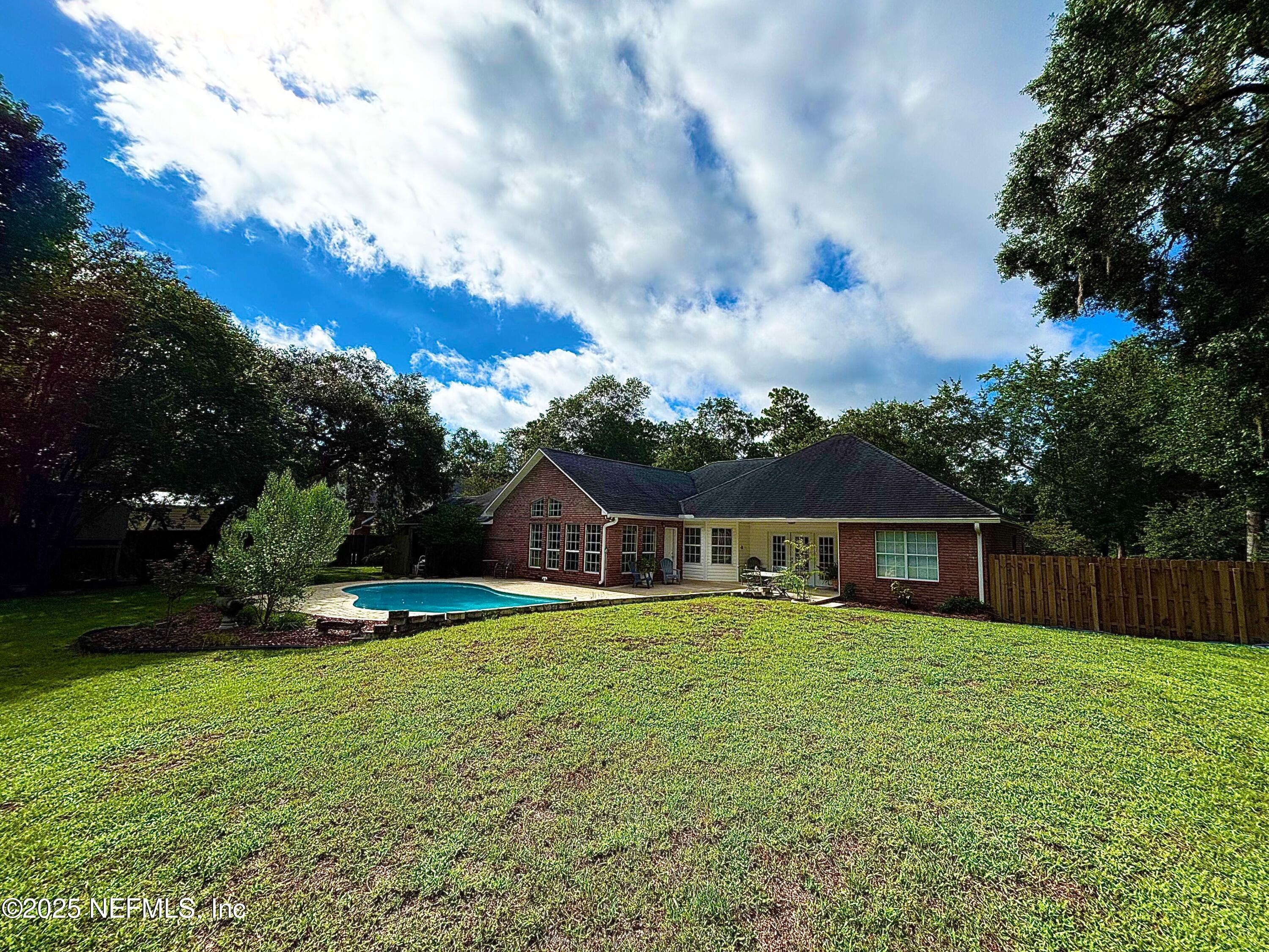 6121 Michele Road Macclenny, FL 32063 - Photo 14 of 26 a view of a house with a yard