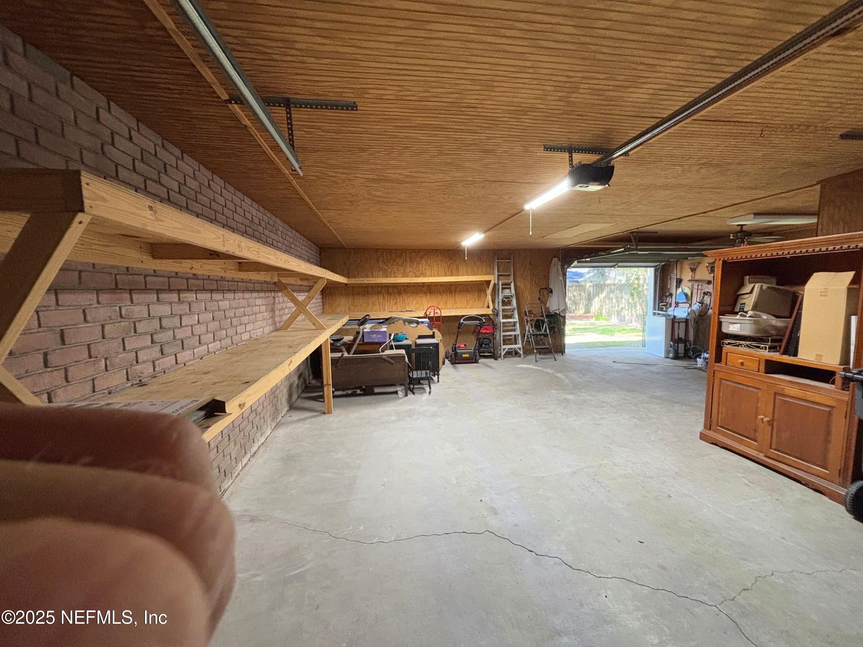 6121 Michele Road Macclenny, FL 32063 - Photo 25 of 26 a view of parking garage with cars parked