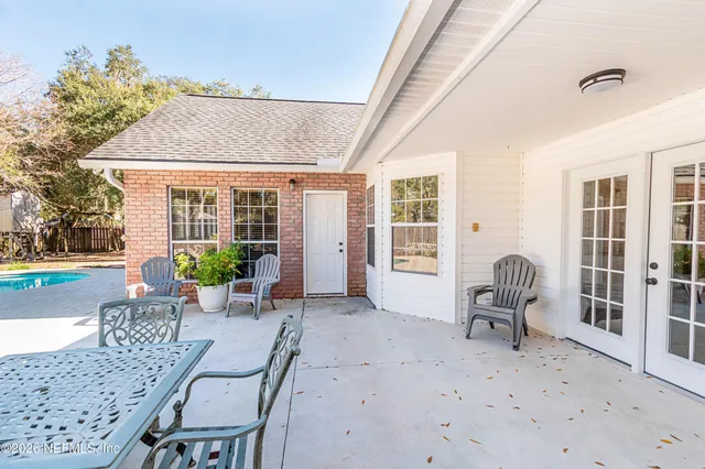 a spacious bedroom with a bed and a couch