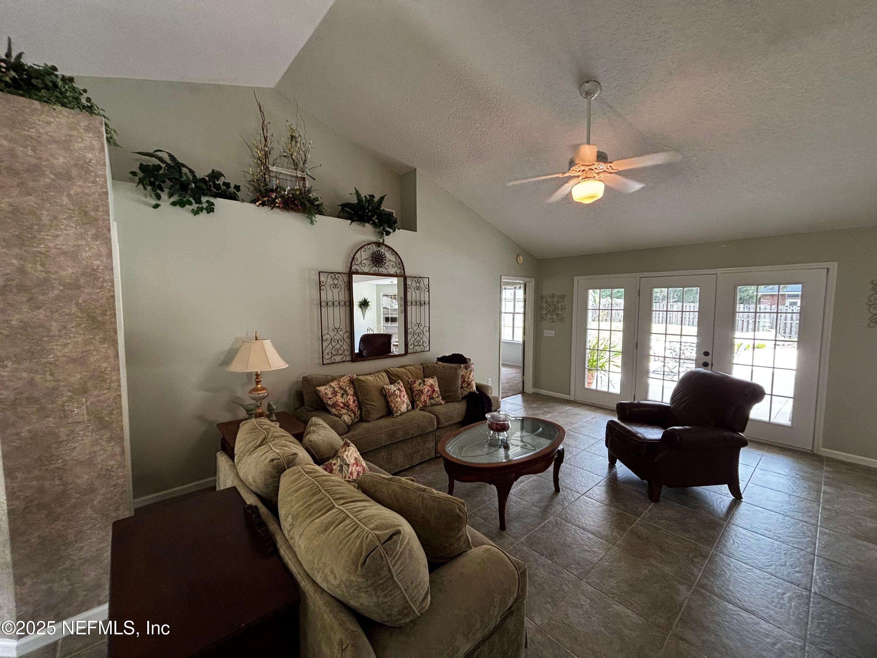 6121 Michele Road Macclenny, FL 32063 - Photo 9 of 26 a living room with furniture and wooden floor