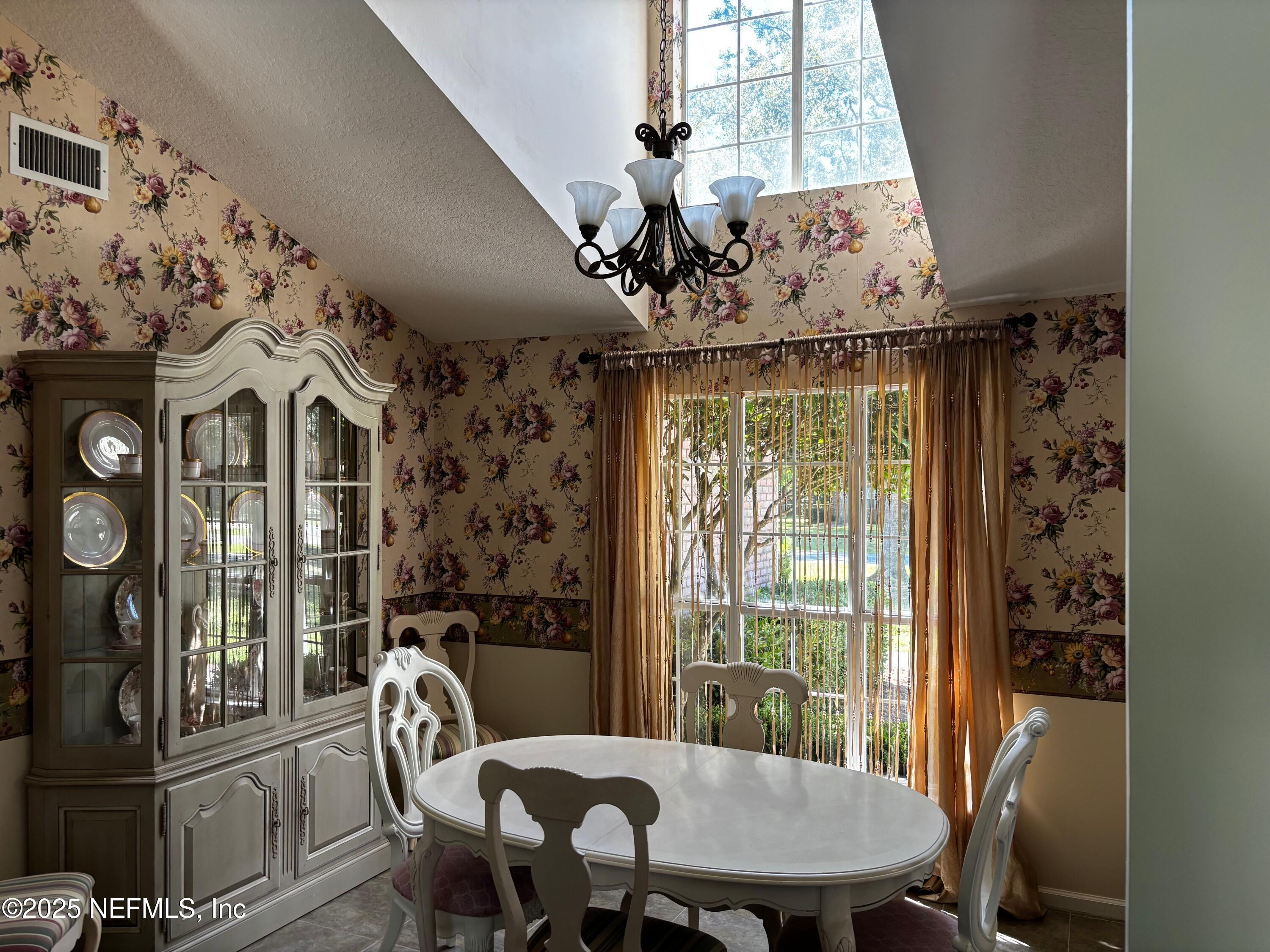 6121 Michele Road Macclenny, FL 32063 - Photo 10 of 26 a view of a dining room with furniture window and outside view