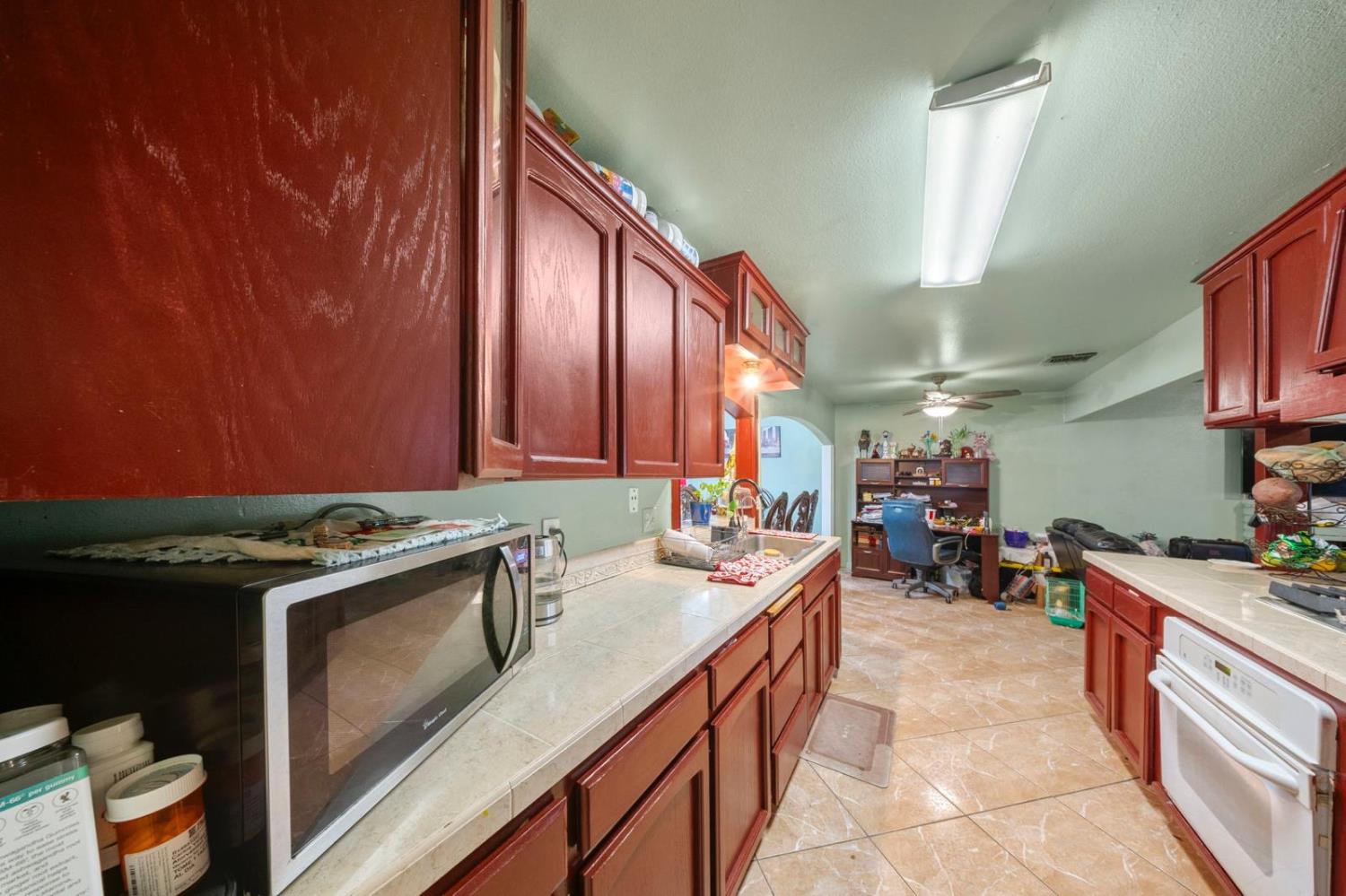 3140 Kellogg Avenue Turlock, CA 95382 - Photo 13 of 22 a kitchen that has a sink and a stove