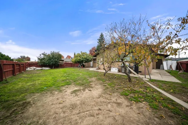 a view of backyard with green space