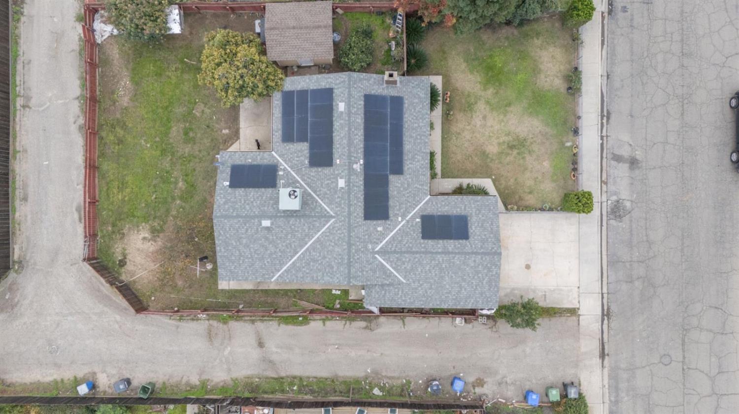3140 Kellogg Avenue Turlock, CA 95382 - Photo 6 of 22 an aerial view of a house with a yard and large tree