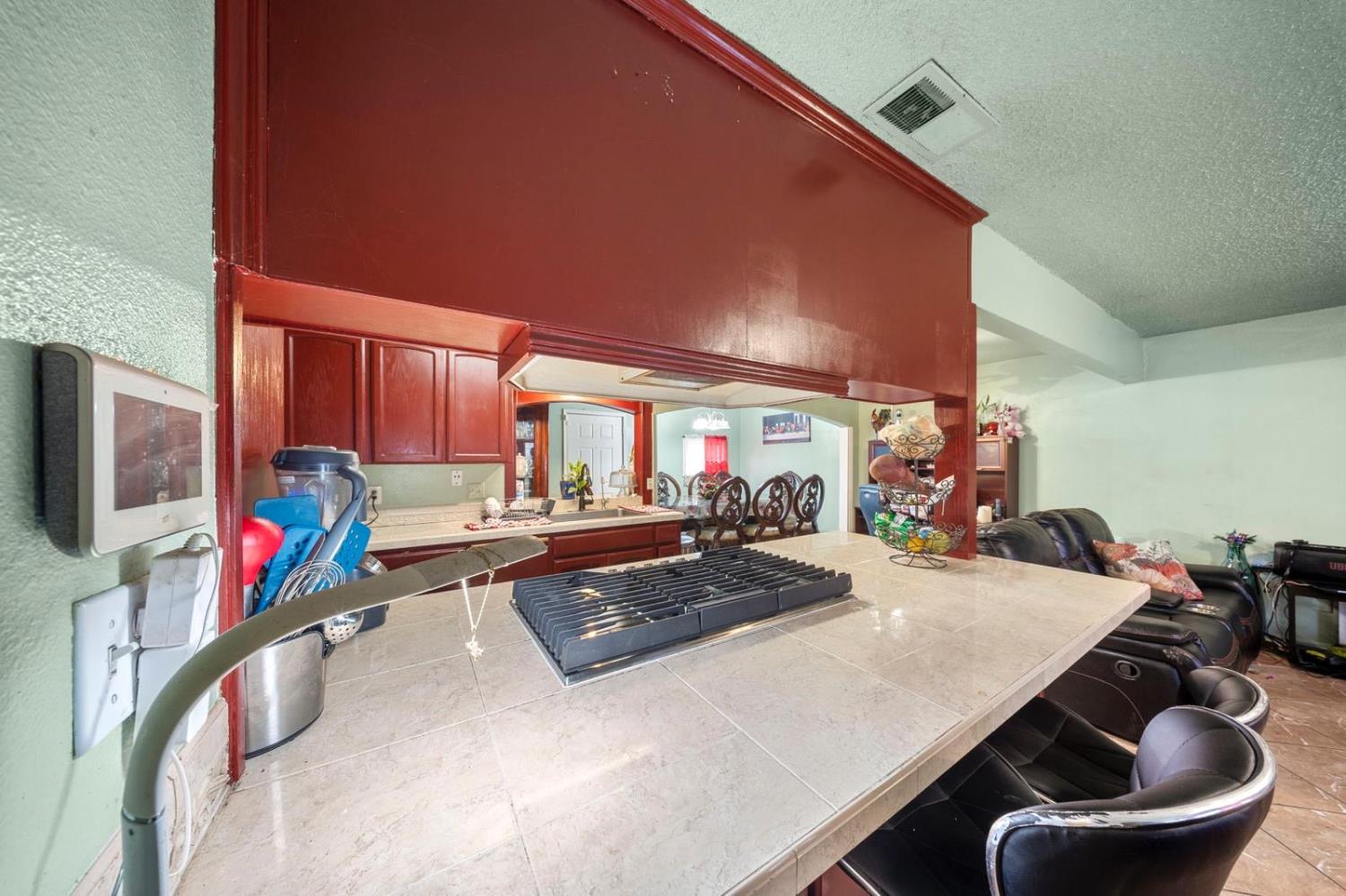 3140 Kellogg Avenue Turlock, CA 95382 - Photo 9 of 22 a room with furniture a flat screen tv and a large window