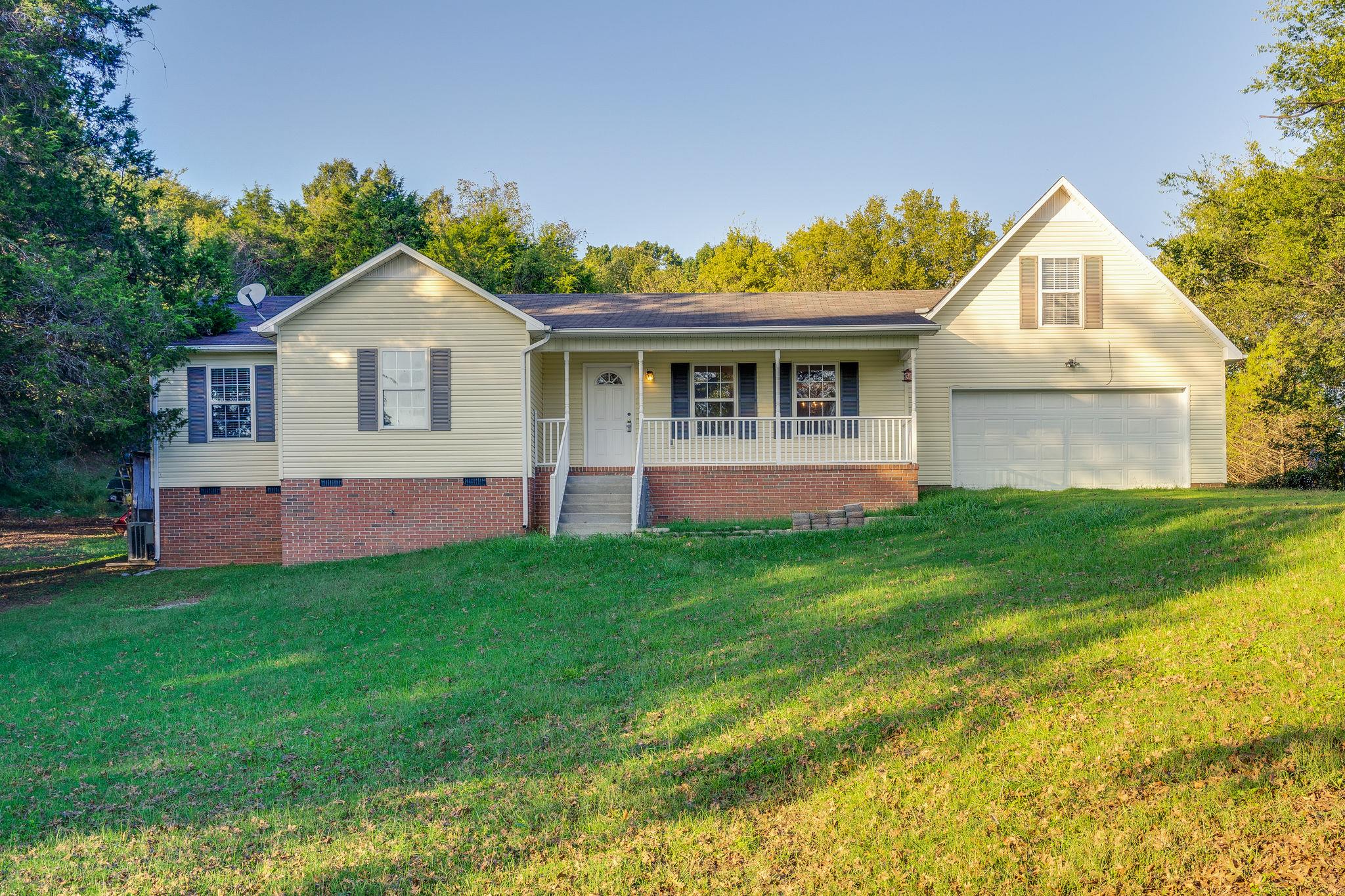 1253 Iron Bridge Road Columbia, TN 38401 - Photo 2 of 24 a front view of house with yard and green space