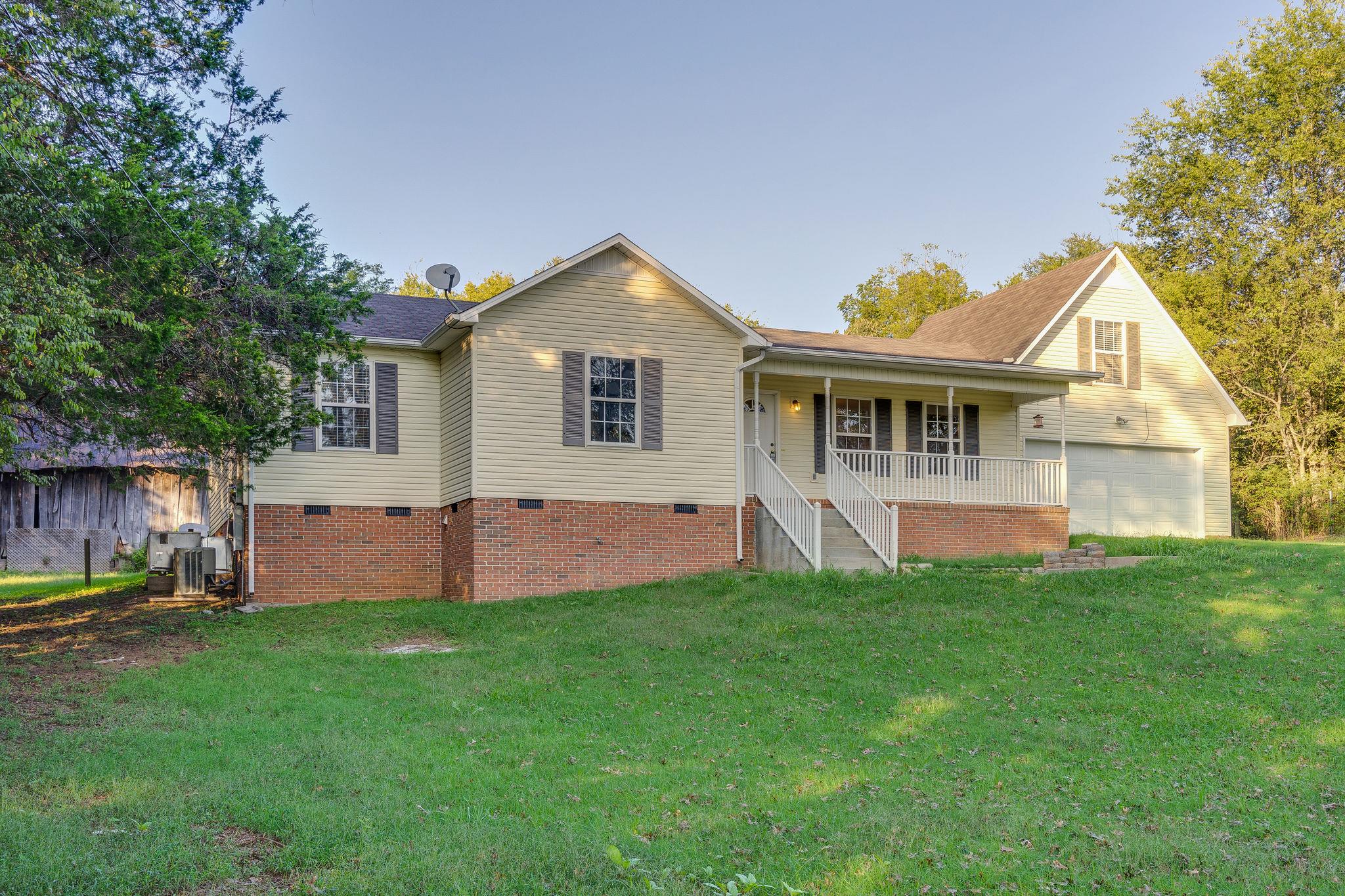 1253 Iron Bridge Road Columbia, TN 38401 - Photo 3 of 24 a view of a house with a yard and sitting area