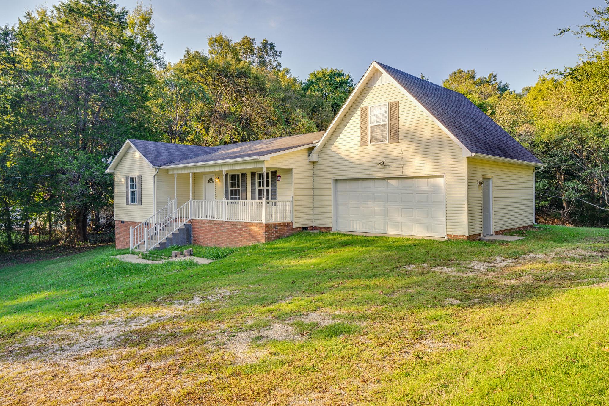 1253 Iron Bridge Road Columbia, TN 38401 - Photo 4 of 24 a view of a house with a backyard
