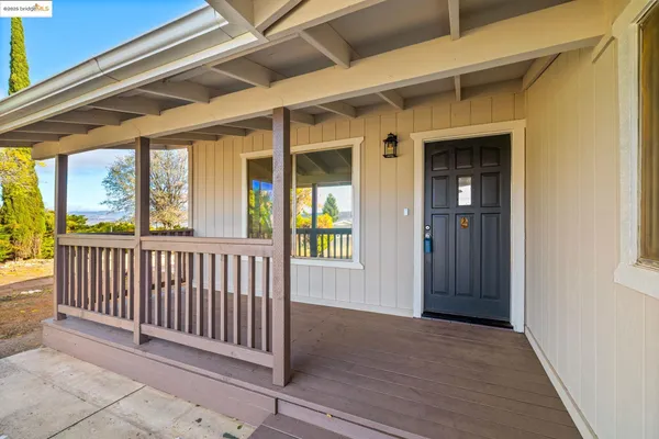 a view of porch with a small cabin