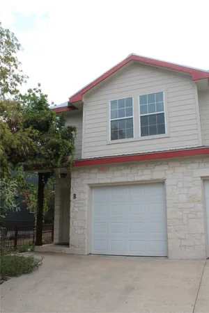 a front view of a house with garage