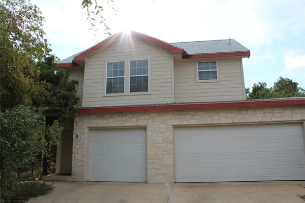 a front view of a house with garage