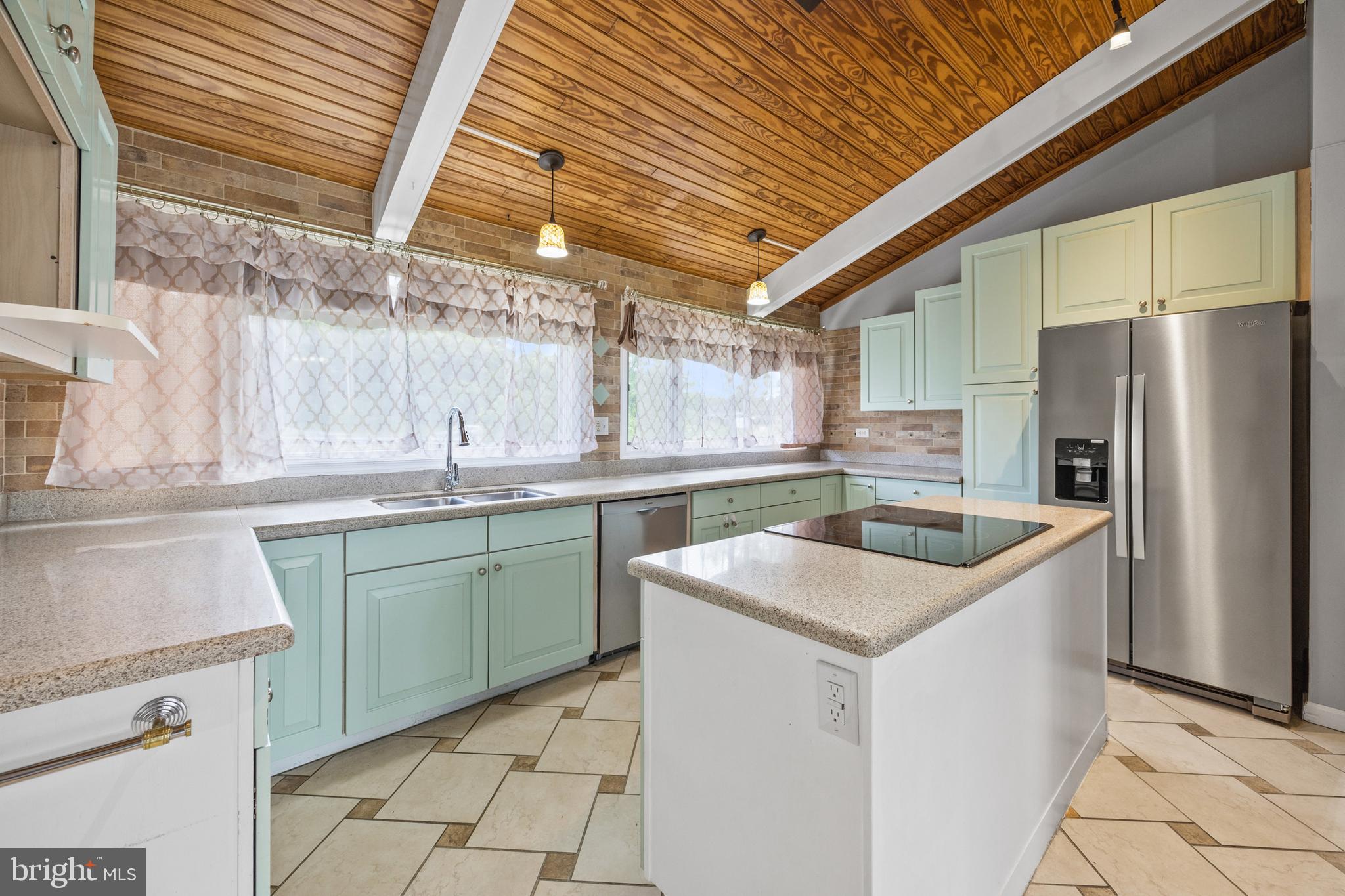 2370 Highway 211 Luray, VA 22835 - Photo 14 of 68 a kitchen with granite countertop a sink and a refrigerator