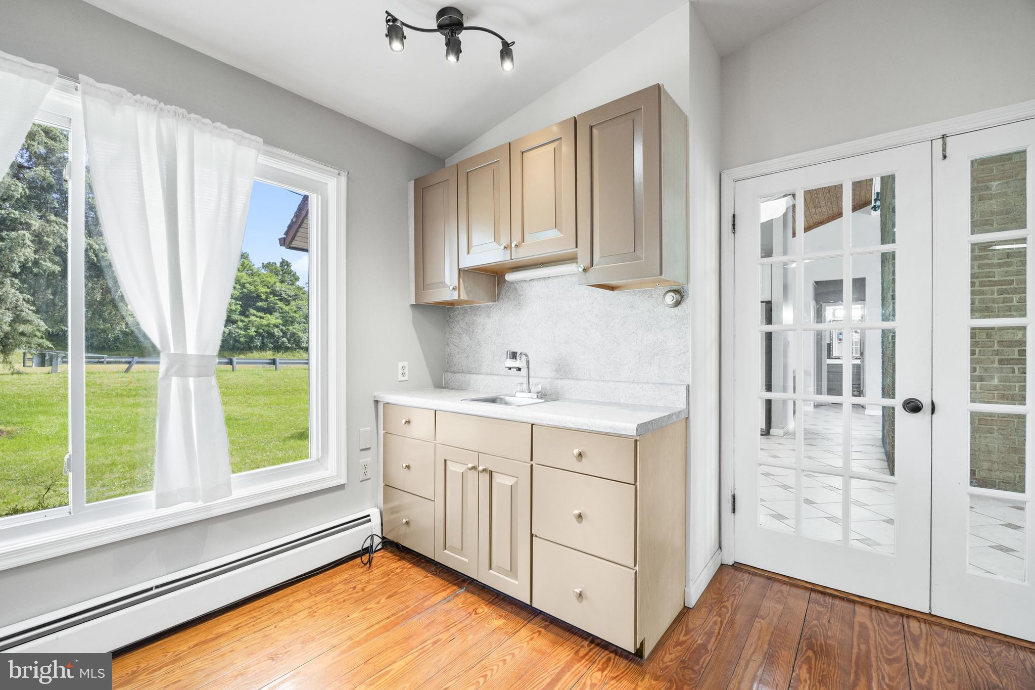 2370 Highway 211 Luray, VA 22835 - Photo 19 of 68 a view of a kitchen with a sink a fireplace and a window