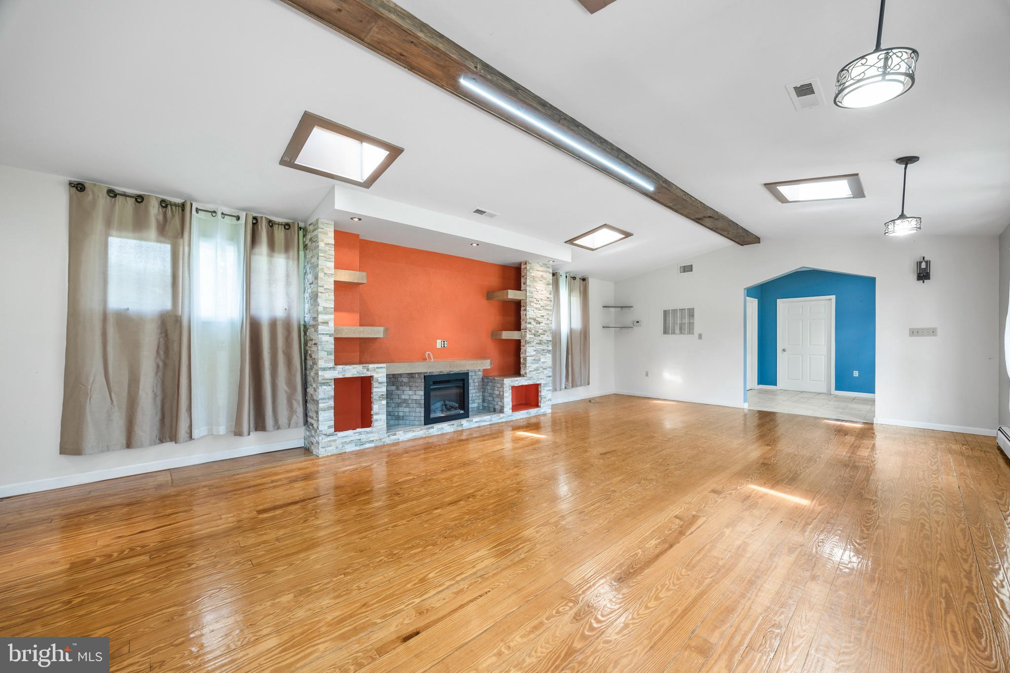 2370 Highway 211 Luray, VA 22835 - Photo 20 of 68 a view of an empty room with wooden floor and a window