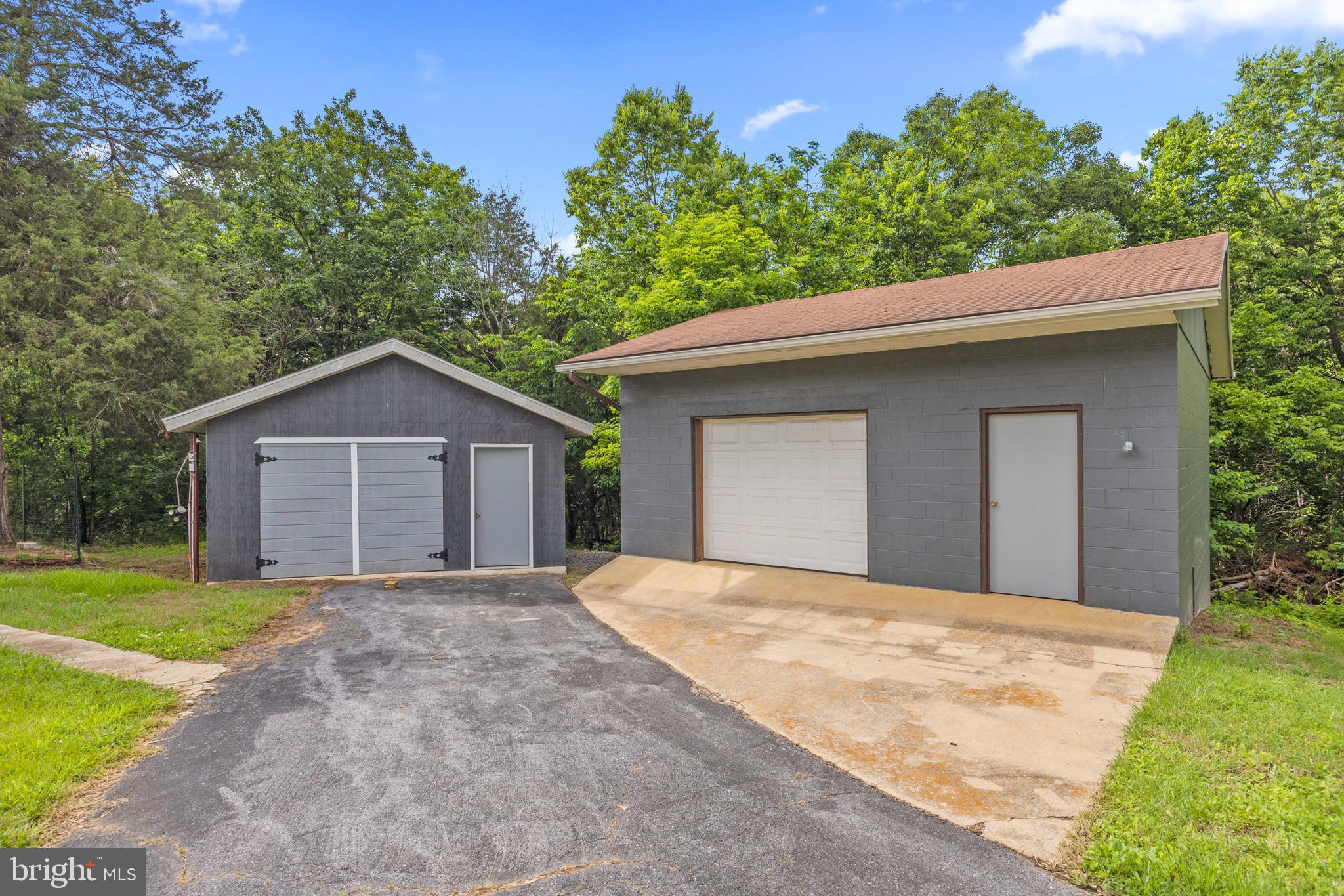 2370 Highway 211 Luray, VA 22835 - Photo 3 of 68 a front view of a house with a yard and garage