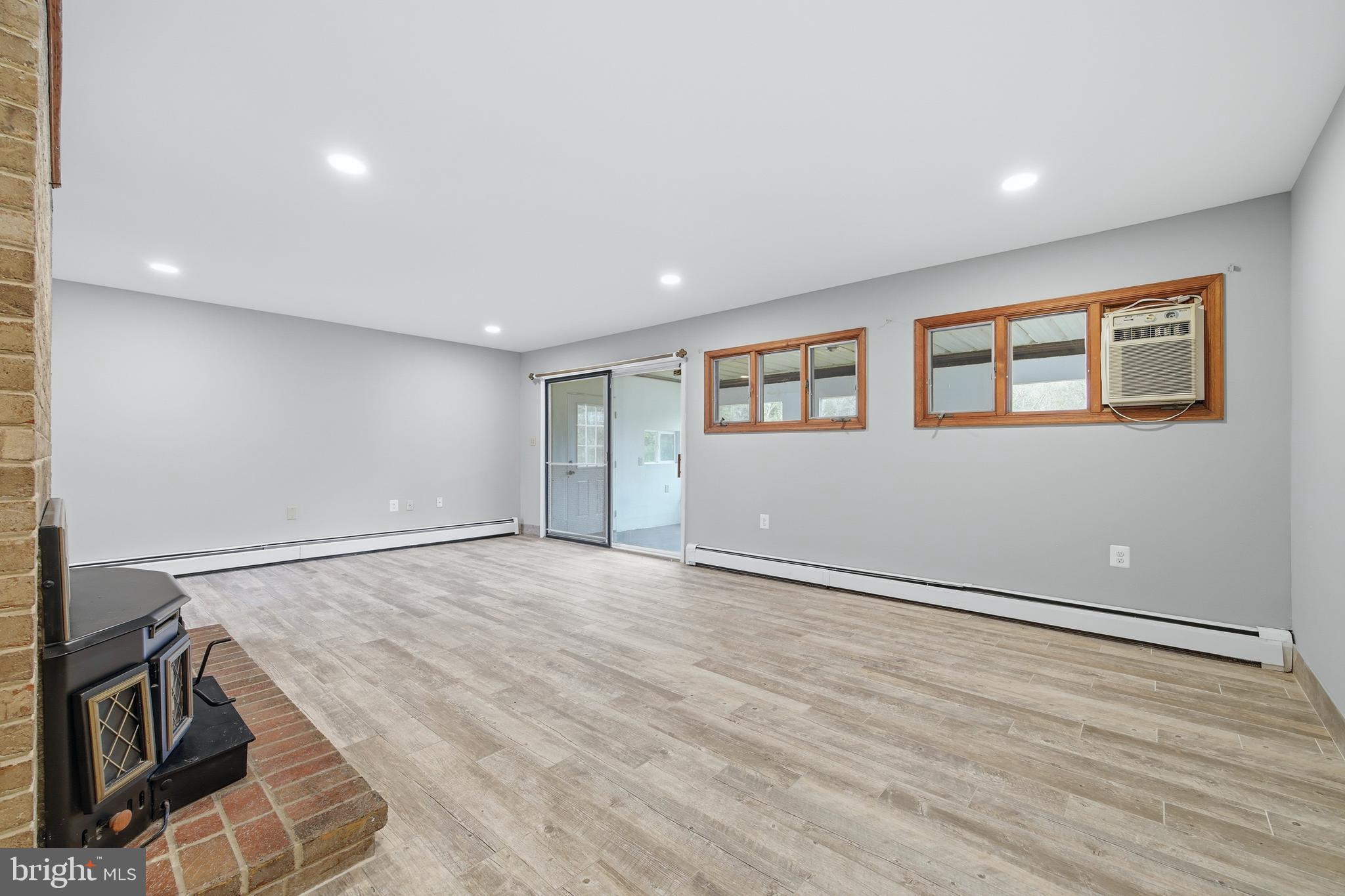 2370 Highway 211 Luray, VA 22835 - Photo 34 of 68 a view of an empty room with wooden floor and a window