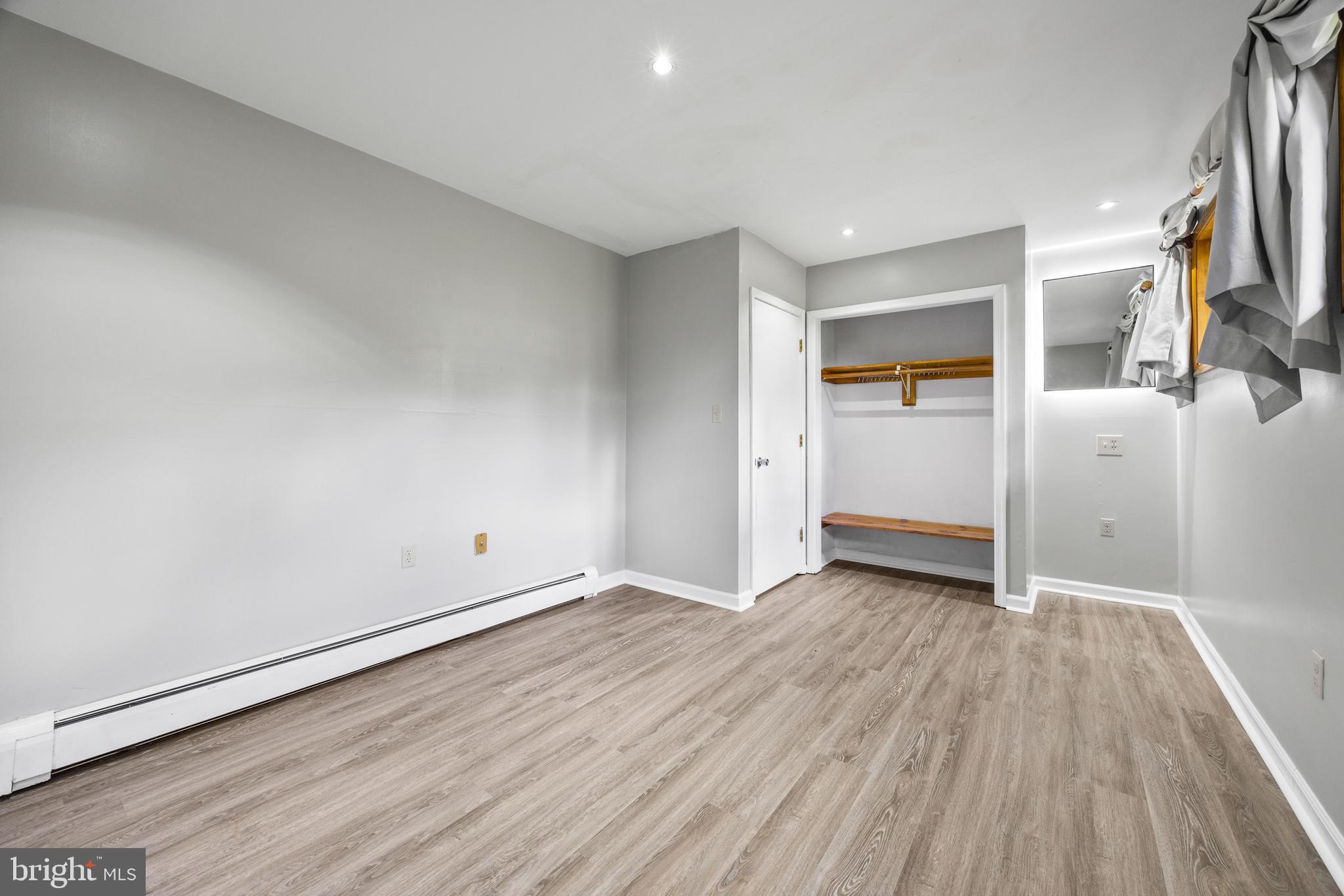 2370 Highway 211 Luray, VA 22835 - Photo 46 of 68 an empty room with wooden floor and entrance